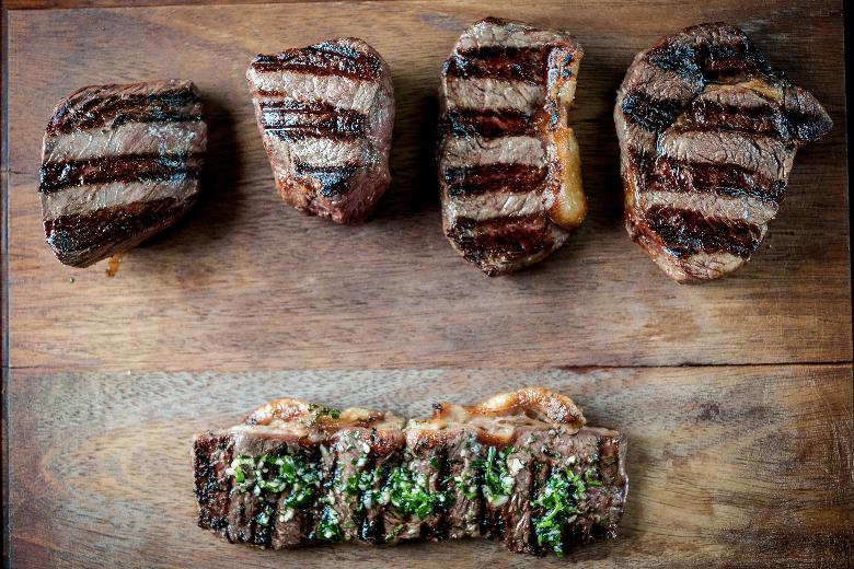 Four people having al fresco drinks